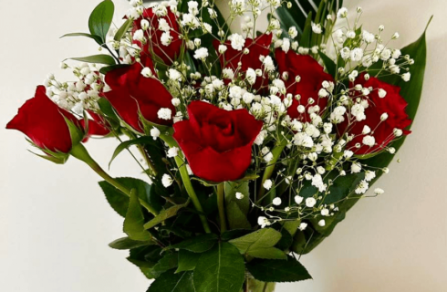 A bouquet of red roses in a vase.